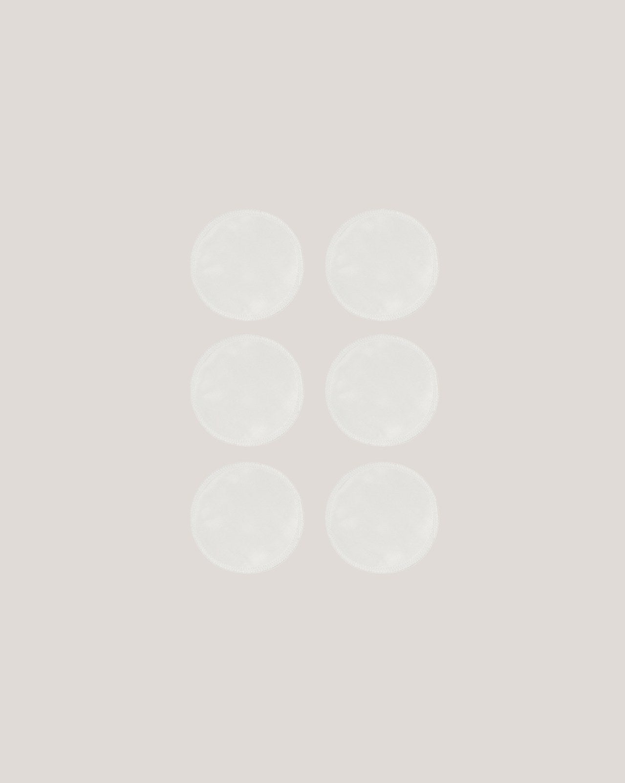 Seks hvide Carriwell ammeindlæg i silke lagt i grid